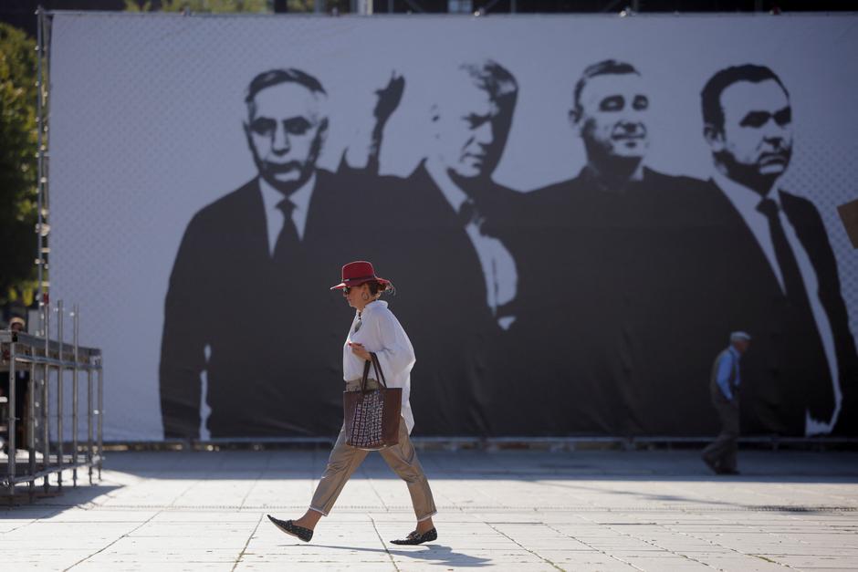 Giant banner depicting former Kosovo President Hashim Thaci, former heads of the Assembly of Kosovo, Jakup Krasniqi and Kadri Veseli and former parliamentary leader of the political party Vetevendosje, Rexhep Selimi, in Pristina | Author: Valdrin Xhemaj