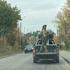 Ukrainian serviceman rides in a pickup truck in Kramatorsk