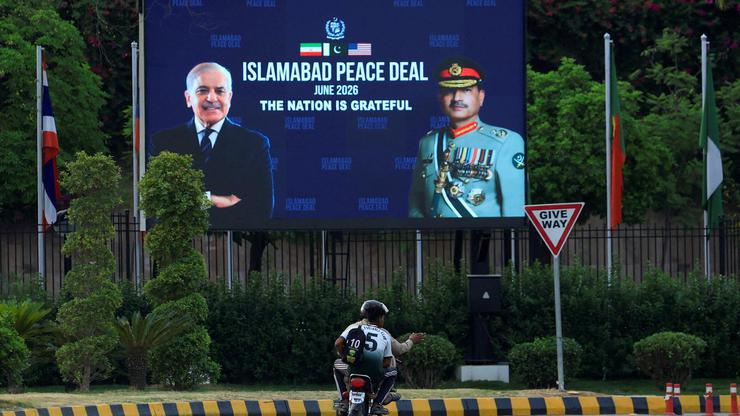 Billboard displaying portraits of Pakistan's Chief of Army Staff Field Marshal Asim Munir and Prime Minister Shehbaz Sharif, following a deal between the U.S. and Iran, in Islamabad