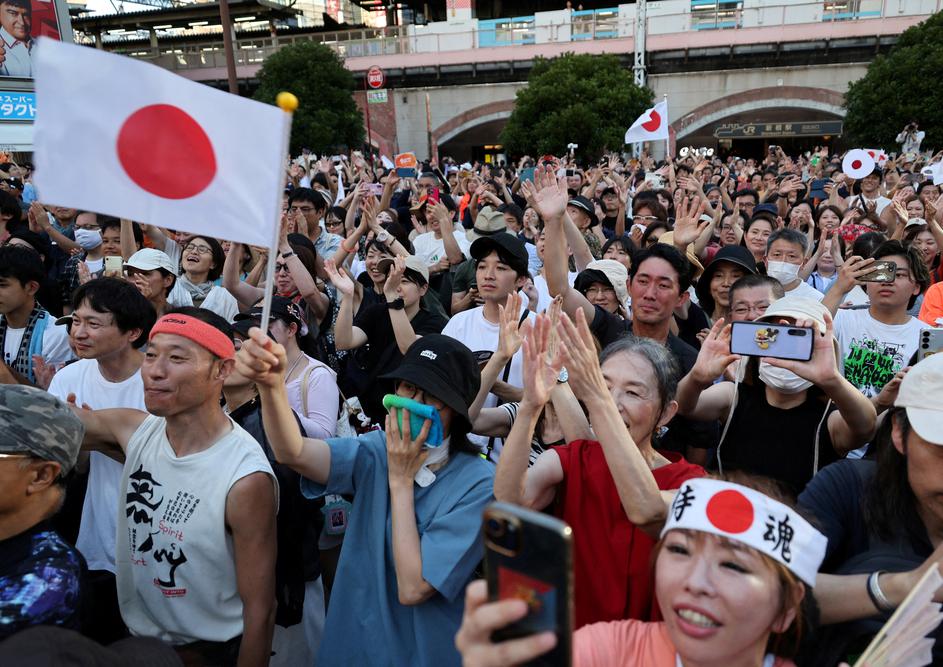 FILE PHOTO: Supporters of Japan's Sanseito party leader react during the party’s rally in Tokyo