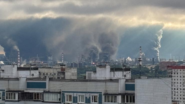 FILE PHOTO: Thick plumes of smoke with flames rise from an oil refinery in Moscow