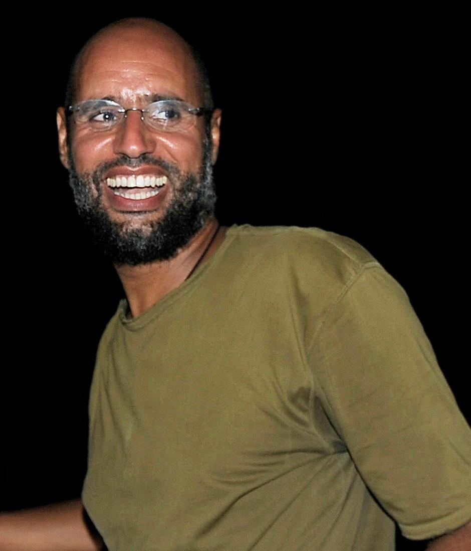 FILE PHOTO: File photo of Saif al-Islam, the son of Libyan leader Muammar Gaddafi, greeting supporters in Tripoli | Author: Paul Hackett/REUTERS