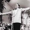 This image shows Italian singer Domenico Modugno performing at the 1958 Sanremo Festival, an important Italian music competition, where he became famous for 'Nel blu dipinto di blu.'