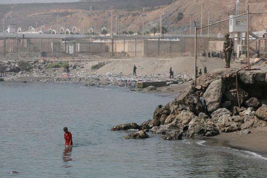Mass crossings of migrants on foot and by sea from Morocco into Spanish territory, in Ceuta