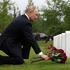 Russian President Vladimir Putin lays flowers at the graves of Soviet soldiers at Fort Richardson National Cemetery near Anchorage