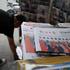 Newspapers with images of Chinese President Xi Jinping meeting U.S. President Donald Trump at the Great Hall of the People, are displayed in Beijing