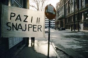 BEWARE SNIPER SIGN PAINTED ON WHITE SHEET IN SARAJEVO 1994