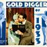 'Gold Diggers of 1933' is a classic 1933 film directed by Mervyn LeRoy. This lobby card features the cast in one of the musical numbers from the movie, showcasing the film's extravagant production and choreography.