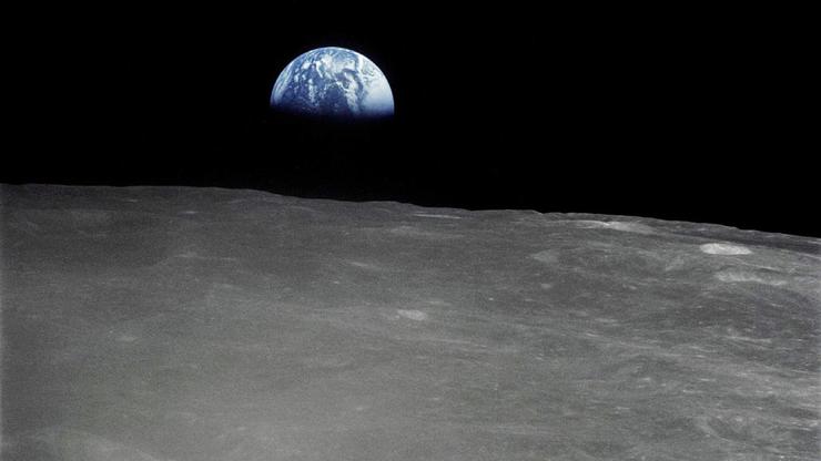Earthrise - the crescent earth rising above the limb of the moon