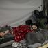 People take shelter inside a metro station during a Russian missile and drone attack, in Kyiv