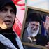 No War Demonstration in Washington, DC, USA. A woman holds a photo of Ayatollah Ali Khamenei during a protest against US