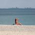 A woman sunbathes at the beach in Yevpatoriya