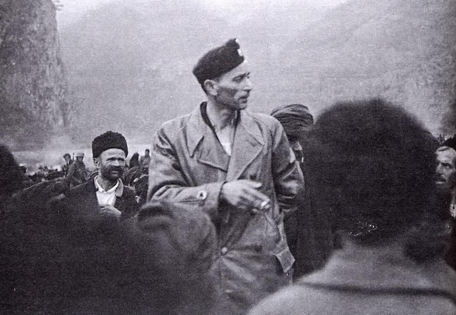 Historical photograph from 1942 showing Croatian Ustaše officer Jure Francetić with Serbian refugees during World War II, documenting wartime displacement and ethnic conflict in the Balkans. | Author: 