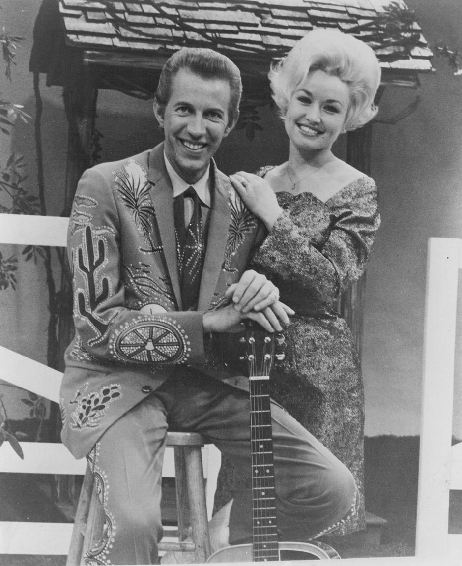 An image of country music icons Porter Wagoner and Dolly Parton, captured together, showcasing their collaboration in the country music industry. | Author: 