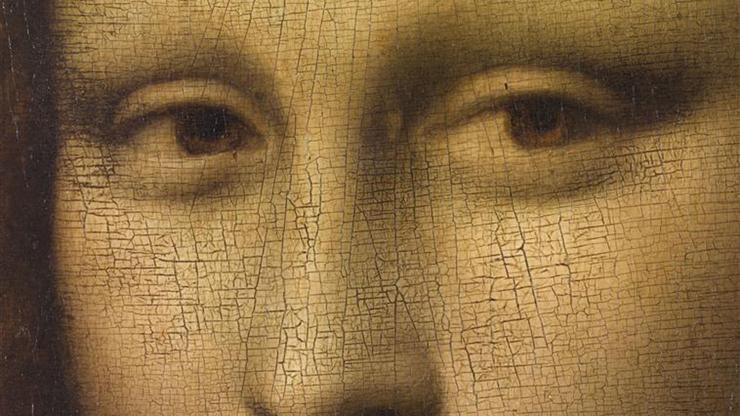 This famous detail of the *Mona Lisa*, painted by Leonardo da Vinci, highlights the enigmatic eyes of the subject. The portrait, housed in the Louvre, is renowned for its intricate rendering and the mysterious expression of the sitter, which has intrigued