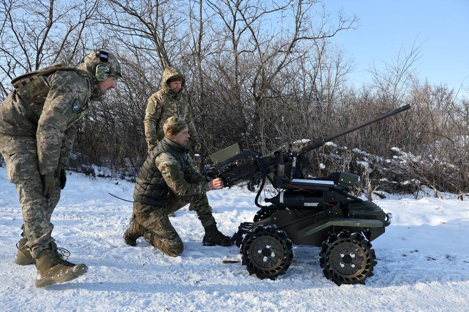 Ukrainian service members check and test a Browning М2 machine gun installed atop of a ground unmanned vehicle near a frontline in Zaporizhzhia region | Author: UKRAINIAN ARMED FORCES