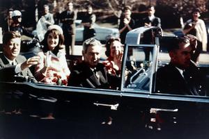 Jackie and John F Kennedy in the limousine, ride through Dallas. 1963