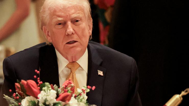 U.S. President Trump takes part in a Christmas Eve dinner in the ballroom of his Mar-a-Lago club in Palm Beach