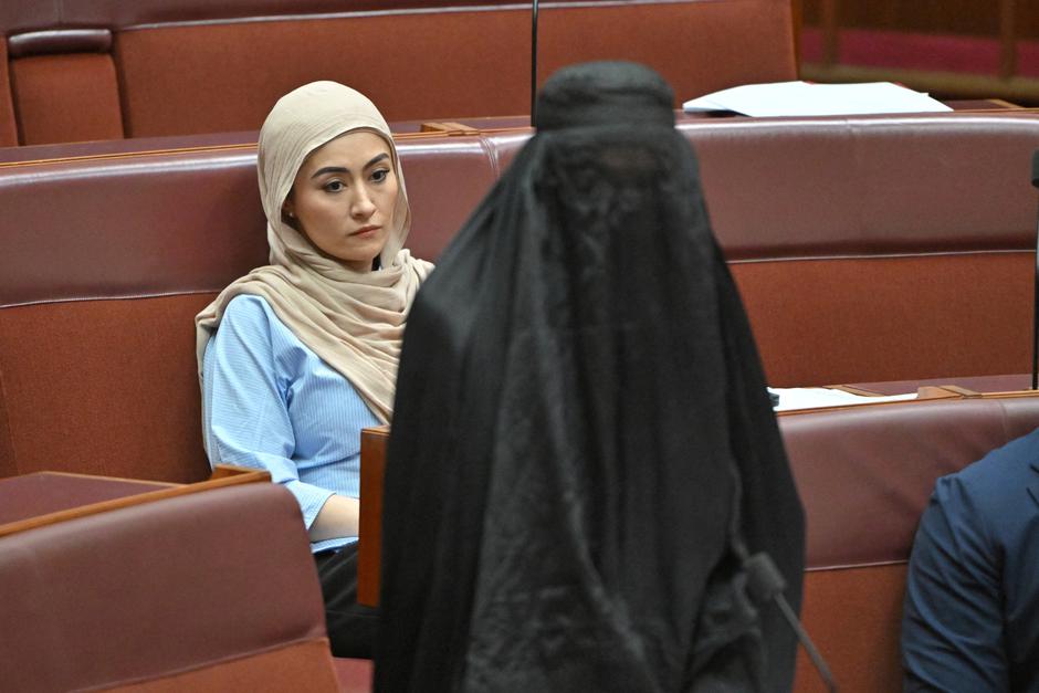 One Nation leader Hanson wears a burqa in the Senate chamber at Parliament House in Canberra | Author: MICK TSIKAS