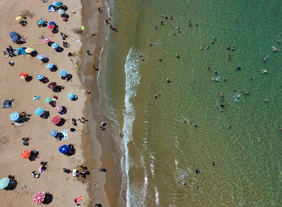 A drone view shows people enjoy a sunny day on a public beach in Kilyos | Author: Murad Sezer