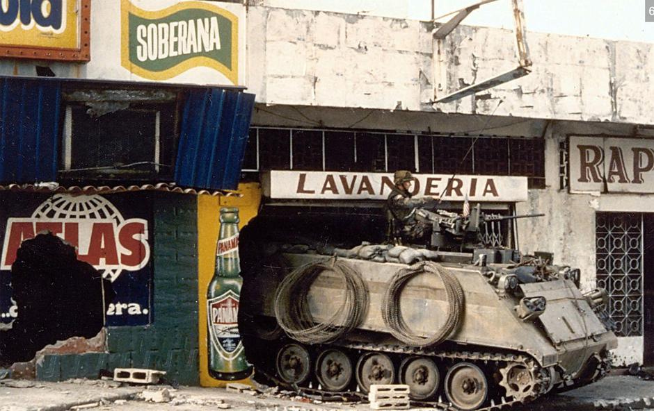 AMERICAN INVASION OF PANAMA  December 1989. An American M113 armoured personnel carrier takes guard outside a laundry during the second day of Operation Just Cause. | Author: Profimedia