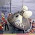The crew of the USS Iwo Jima recovers the Apollo 13 Command Module after splashdown in the South Pacific Ocean on April 17, 1970, marking the successful return of the crew following the aborted mission.