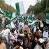 Supporters of Pakistan Markazi Muslim League wave flags during a rally in support of Pakistani Army following India's military strikes on Pakistan, in Islamabad