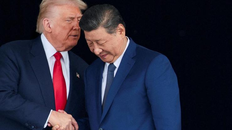 FILE PHOTO: U.S. President Donald Trump meets with Chinese President Xi Jinping on the sidelines of the APEC summit, in Busan
