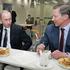 FILE PHOTO: Russian President Putin and Defence Minister Ivanov have coffee in Moscow