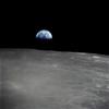Earthrise - the crescent earth rising above the limb of the moon