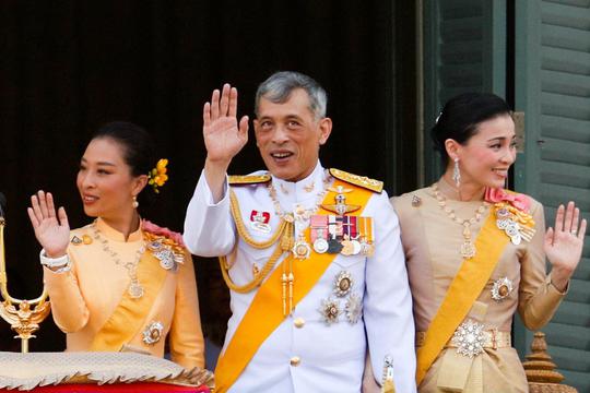 FILE PHOTO: Thailand's King Maha Vajiralongkorn, Queen Suthida and Princess Bajrakitiyabha wave from the balcony of Suddhaisavarya Prasad Hall at the Grand Palace