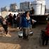 Palestinians gather to collect water, in Gaza City