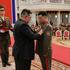 North Korean leader Kim Jong attends a national commendation ceremony at the headquarters of the Central Committee of the Korean Workers' Party,  in Pyongyang