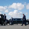 President Donald J. Trump arrives at Miami Beach for the FII PRIORITY Summit, March 27, 2026, stepping from a motorcade vehicle as Secret Service agents stand by on the tarmac. Image courtesy of the White House.