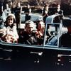 Jackie and John F Kennedy in the limousine, ride through Dallas. 1963