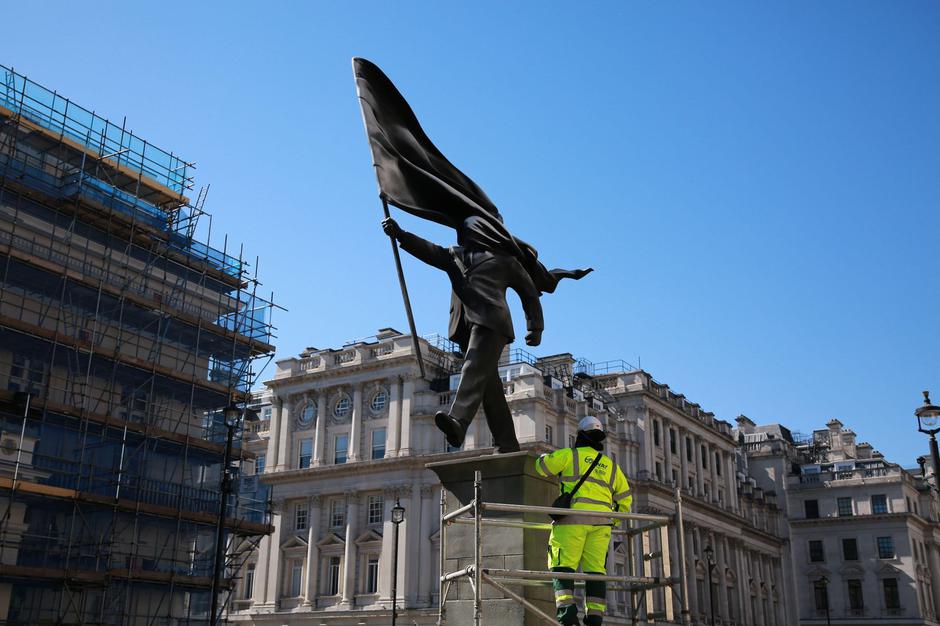 London, UK. 30 April 2026. Workers secure and fence off a newly unveiled Banksy sculpture in Waterloo Place, St James’s, central London, after the artist confirmed the work on Instagram. The statue depicts a suited man blinded by a large flag covering his | Author: Profimedia