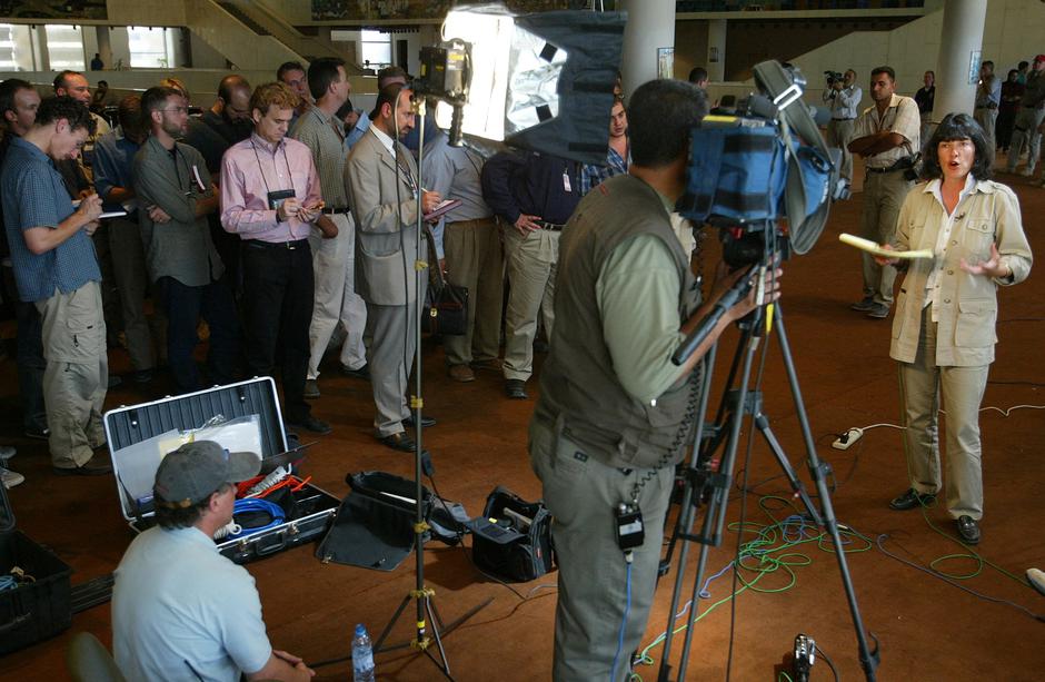 FILE PHOTO: Veteran CNN correspondent Christiane Amanpour makes a live broadcast while surrounded by reporters taking notes in Baghdad | Author: Chris Helgren