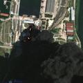 A satellite image shows fire and smoke rising from oil tanks, after what Ukrainian President Volodymyr Zelenskiy said was an attack on an oil depot in the city of Kerch