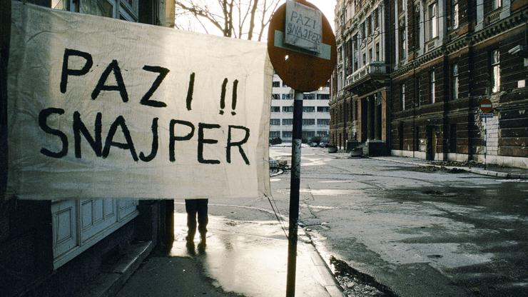 BEWARE SNIPER SIGN PAINTED ON WHITE SHEET IN SARAJEVO 1994