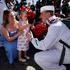 The US Navy Nimitz-class aircraft carrier USS Abraham Lincoln returns home following an extended deployment in the Middle East at Naval Base Coronado in San Diego