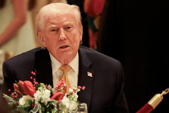 U.S. President Trump takes part in a Christmas Eve dinner in the ballroom of his Mar-a-Lago club in Palm Beach