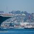The US Navy Nimitz-class aircraft carrier USS Abraham Lincoln returns home following an extended deployment in the Middle East at Naval Base Coronado in San Diego