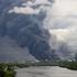 Thick plumes of smoke with flames rise from an oil refinery following a Ukrainian drone attack in Moscow